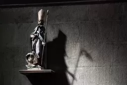 Priest-Abuse—Religious-Statue